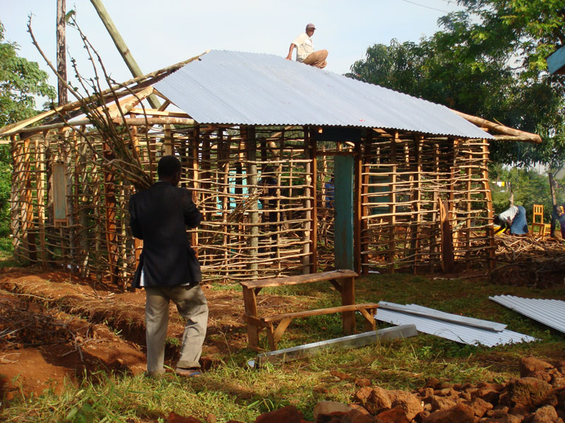 Putting the roof on the kitchen building